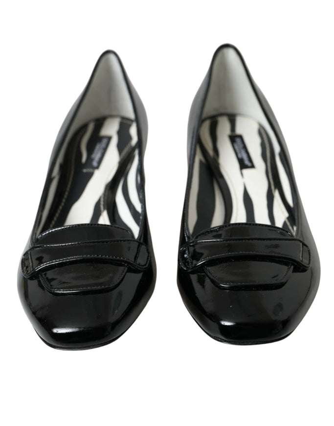 a pair of black and white zebra print shoes