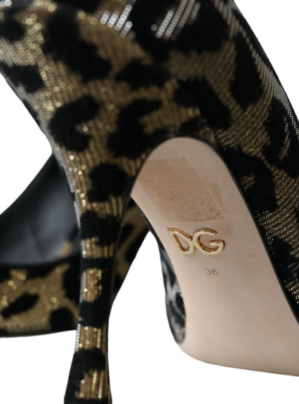 a pair of black and gold high heels