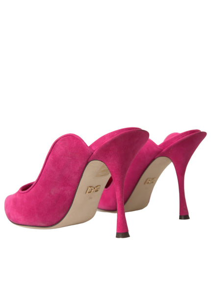 a pair of pink high heel shoes on a white background