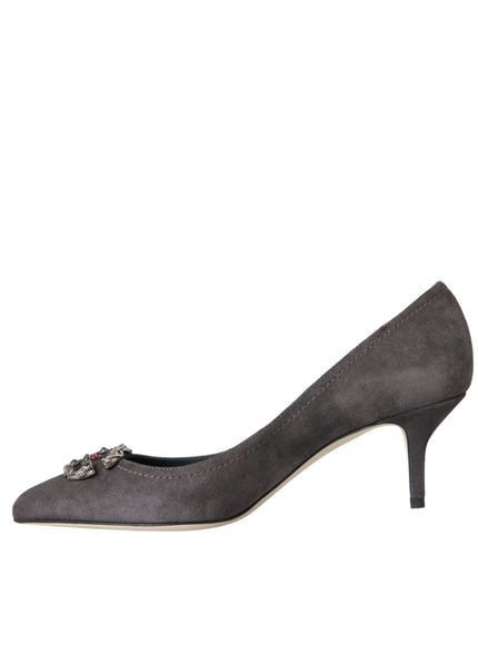 a woman's grey high heeled shoe with a metal buckle