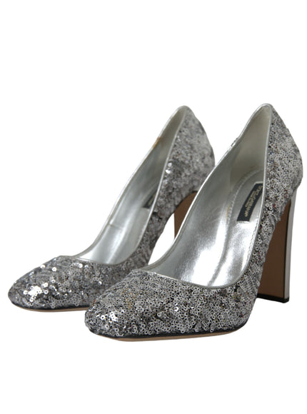 a pair of silver glitter high heels on a white background