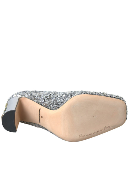 a women's shoe with silver glitters on it