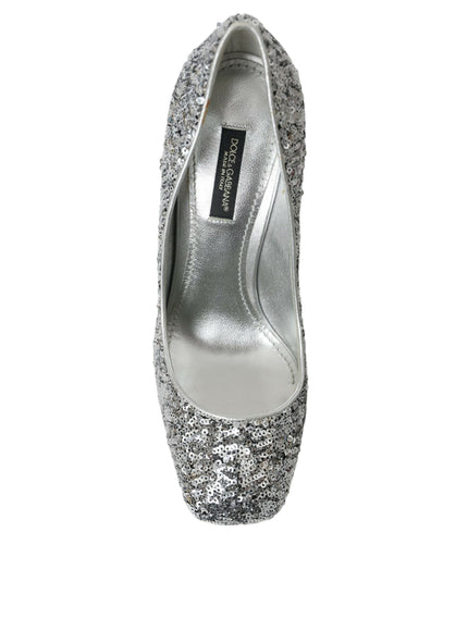 a pair of silver high heels on a white background