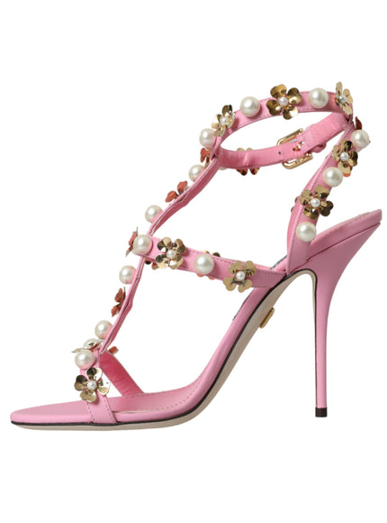 a pink high heeled shoe with pearls and pearls