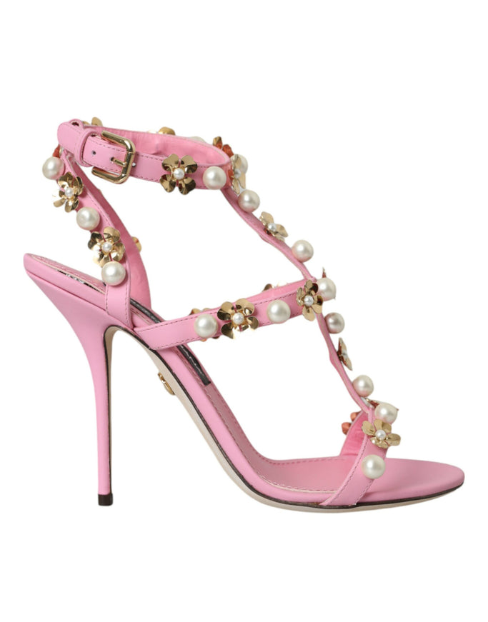 a pink high heeled sandal with pearls