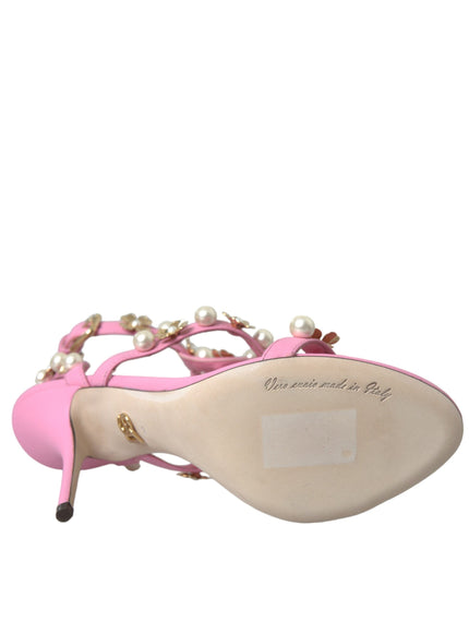 a pair of pink shoes with pearls on them