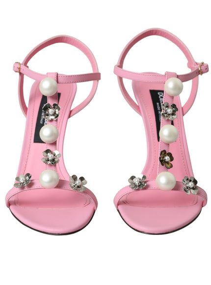 a pair of pink high heels with pearls