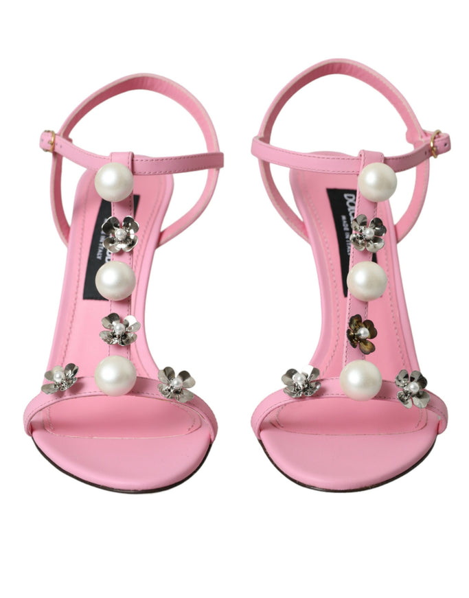 a pair of pink high heels with pearls