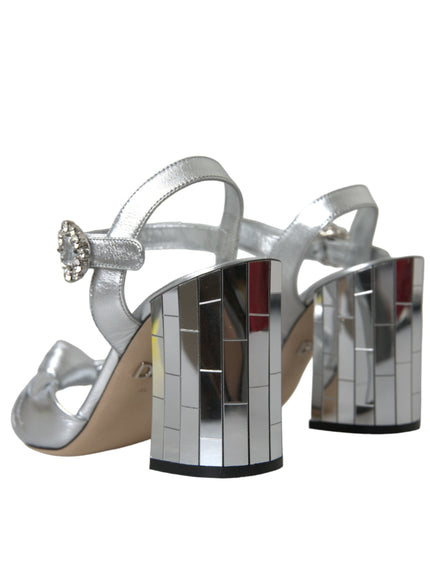 a pair of silver high heeled sandals