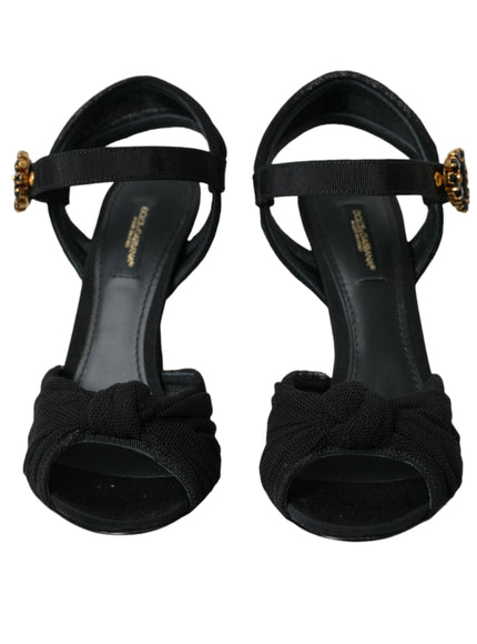 a pair of black high heeled sandals