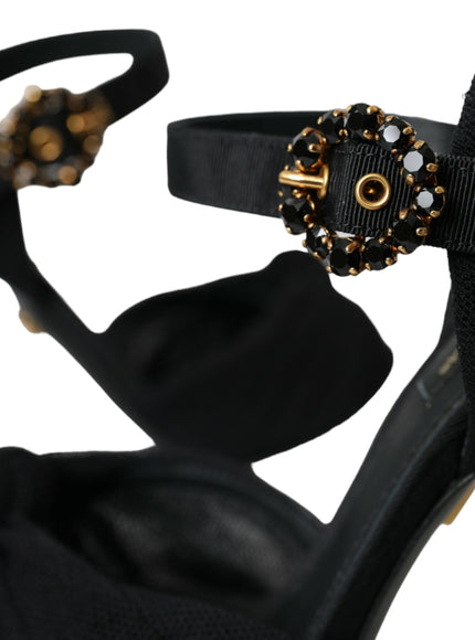 a pair of black high heels with a gold buckle