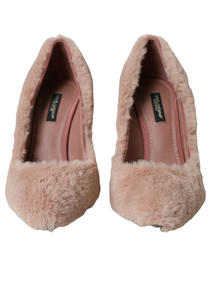 a pair of pink shoes with fur on them