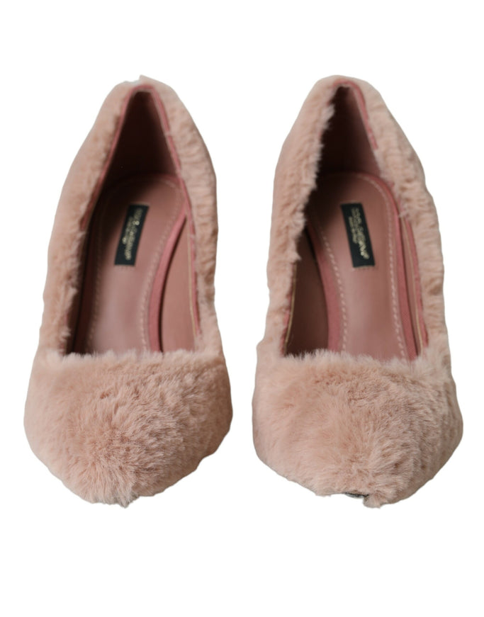 a pair of pink shoes with fur on them