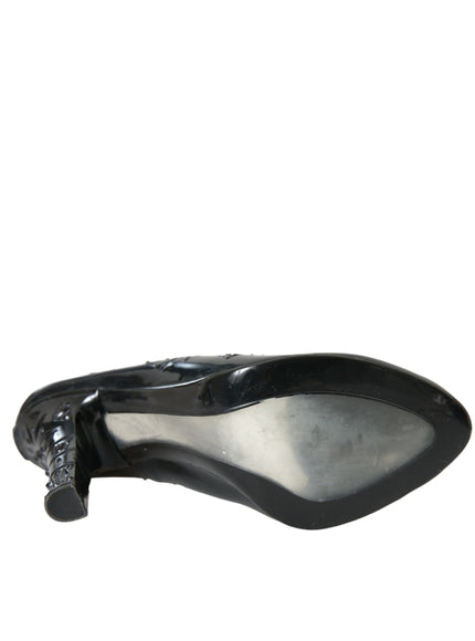 a close up of a black shoe on a white background