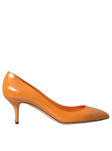 a pair of orange high heels on a white background