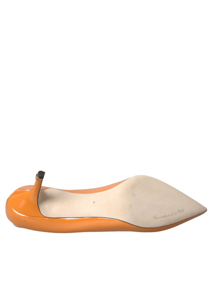 a pair of orange and white shoes on a white background