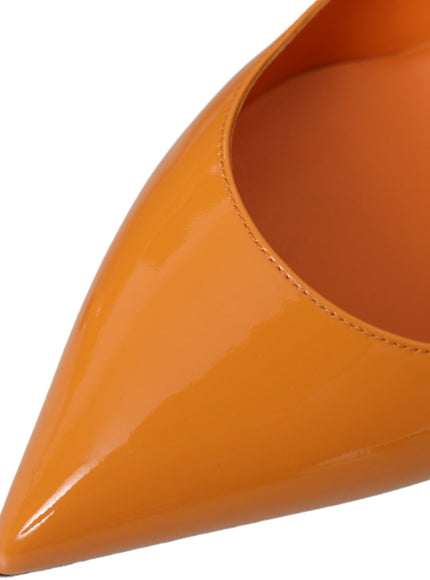 a close up of a pair of orange shoes