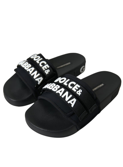 a pair of black slides with white lettering