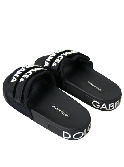 a pair of black sandals with white lettering