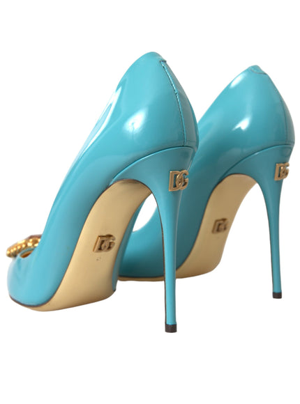 a pair of blue high heels with gold accents