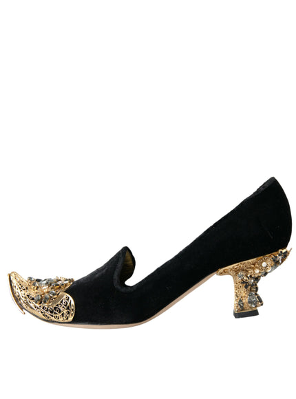 a pair of black and gold shoes on a white background