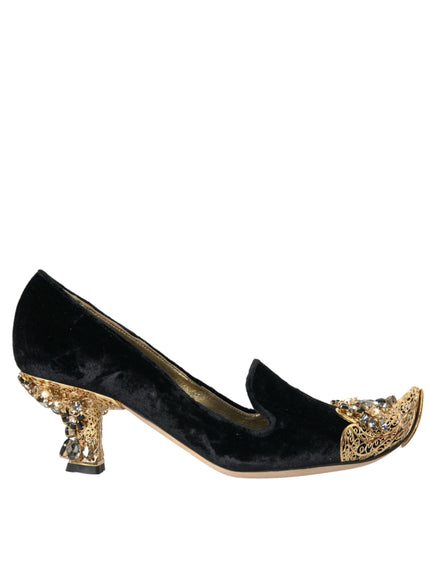 a pair of black and gold shoes on a white background