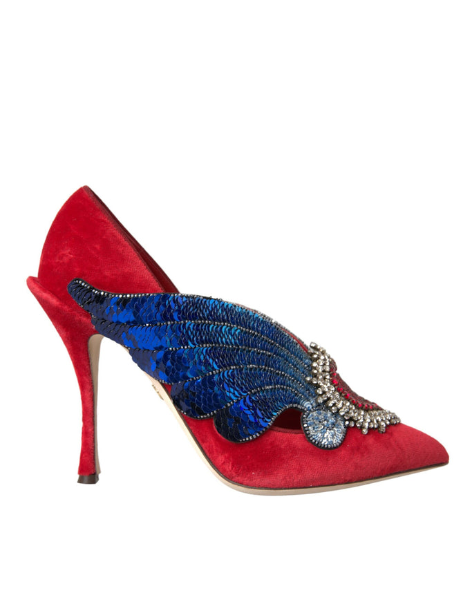 a red high heel shoe with blue and red feathers