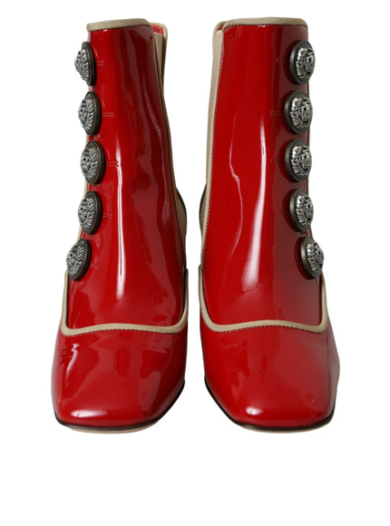 a pair of red shoes with buttons on them