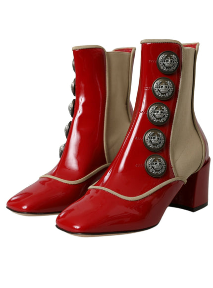 a pair of red boots with buttons on them