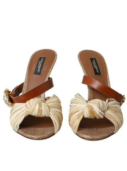 a pair of sandals with a bow on the side