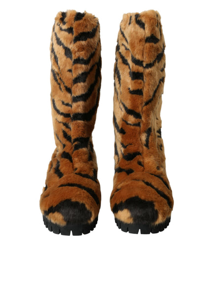 a close up of a pair of boots with a tiger pattern