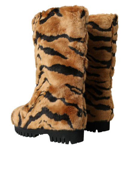 a pair of boots with a tiger print