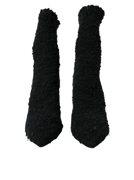 a pair of black mittens on a white background