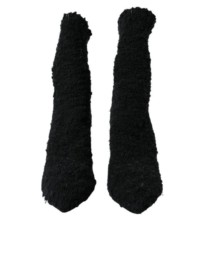 a pair of black mittens on a white background