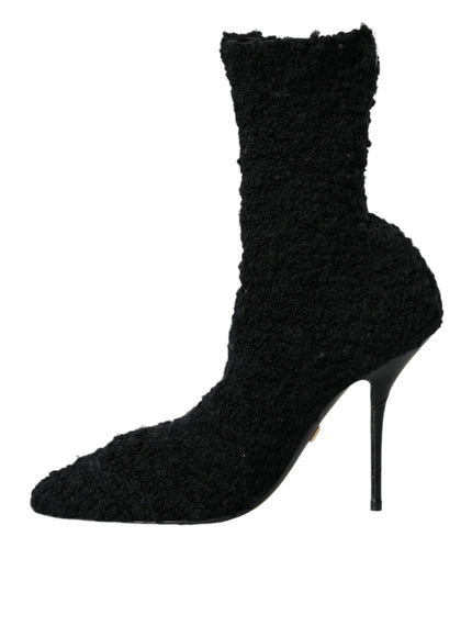 a pair of black high heeled shoes