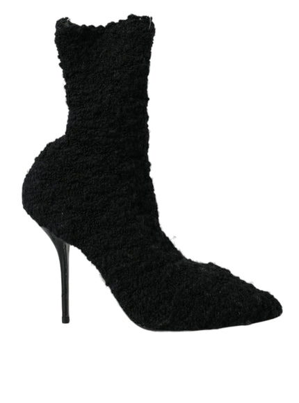 a black high heeled shoe with a furry design