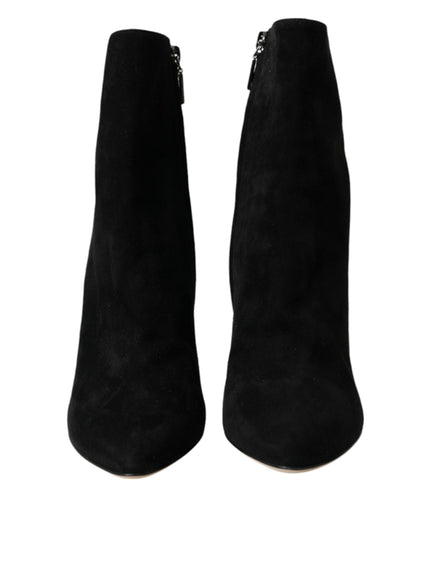 a pair of black boots with zippers