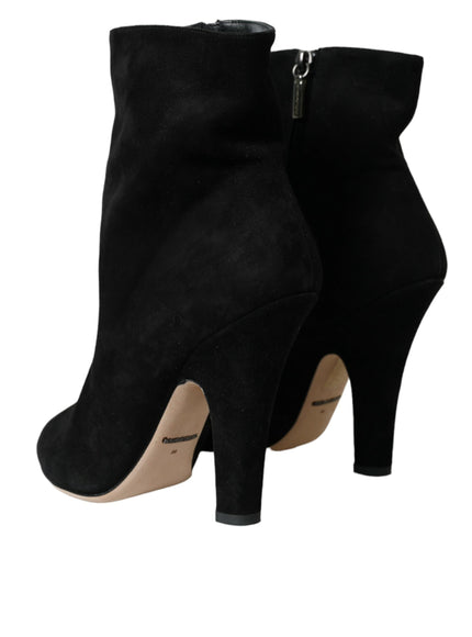 a pair of black high heeled boots