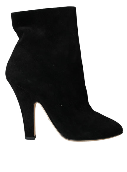 a black high heeled shoe with a pointed toe