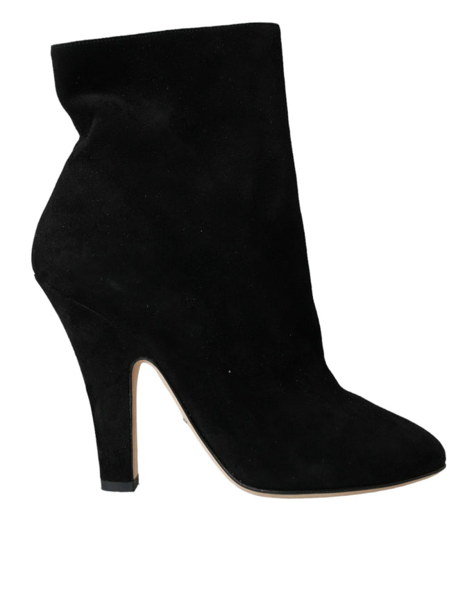 a black high heeled shoe with a pointed toe