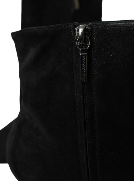 a close up of a black boot with a zipper