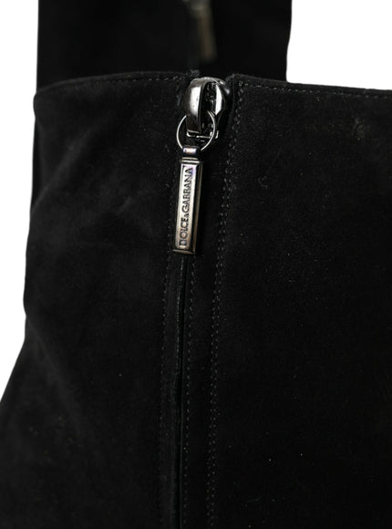 a close up of a black boot with a zipper