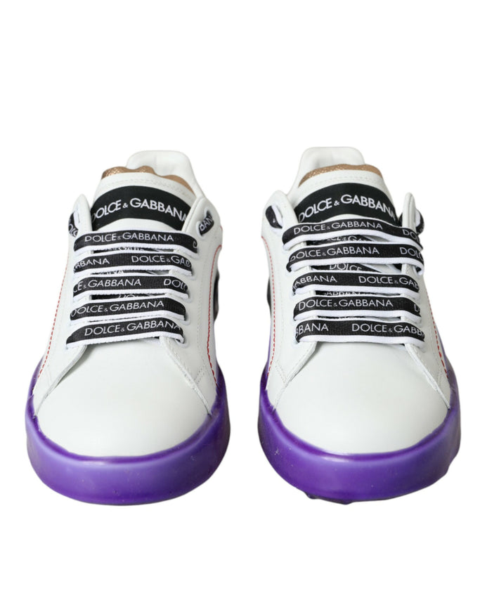 a pair of white sneakers with purple soles