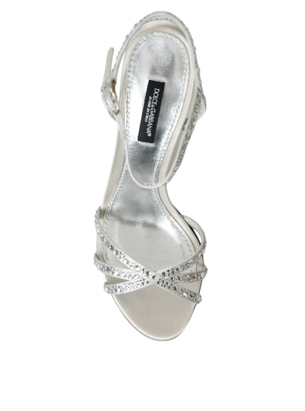 a woman's silver high heeled shoe with a bow