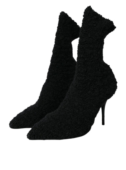 a pair of black high heeled shoes