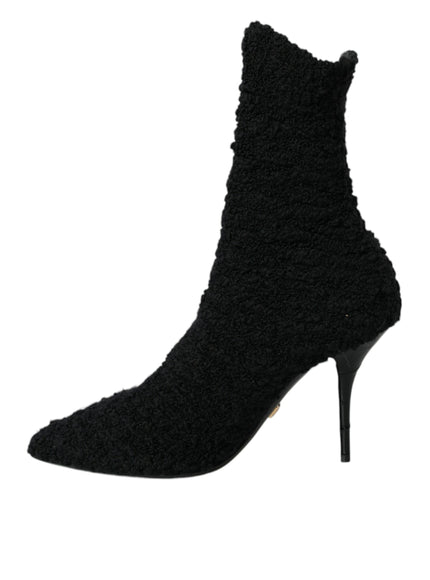 a pair of black high heeled shoes