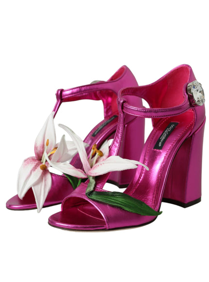 a pair of pink high heels with a flower on the heel