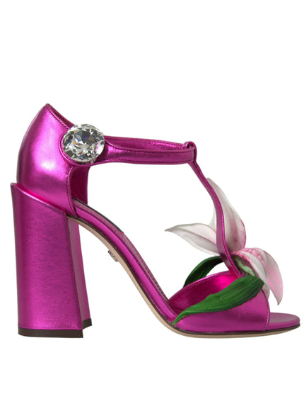 a pink shoe with a flower on the heel