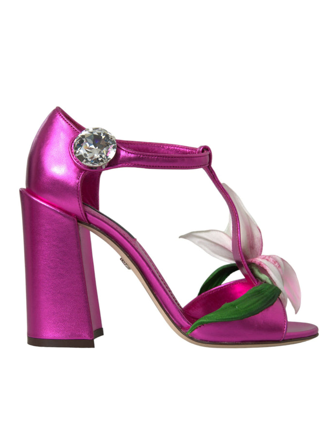 a pink shoe with a flower on the heel