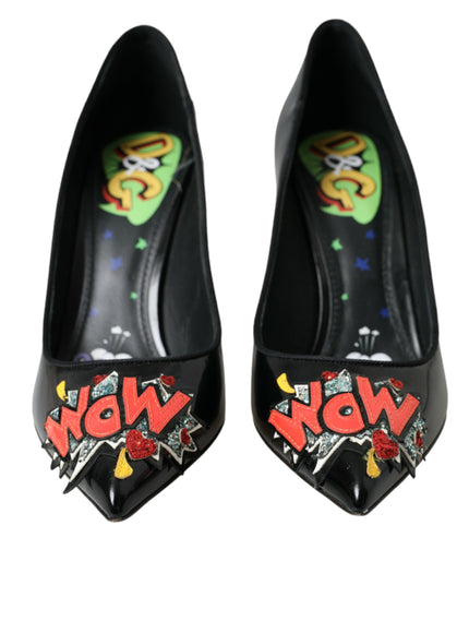 a pair of black high heels with graffiti on them